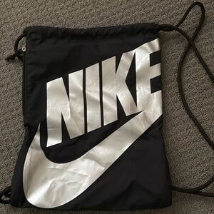 Nike drawstring workout or run bag. Black and silver! Used a few times!